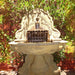 Olive Grove Wall Fountain in action in the garden.
