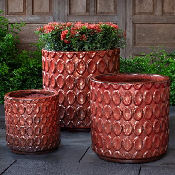 Oriel Planter in glazed brunello on concrete in the backyard.