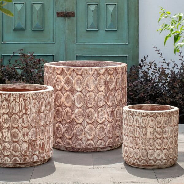 Oriel Planter in glazed murano sol on concrete in the backyard.