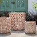 Oriel Planter in glazed murano sol on concrete in the backyard.