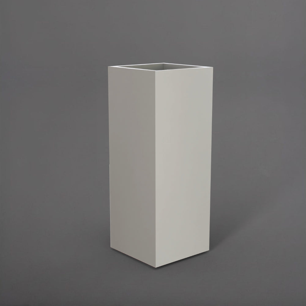 Perth Tall Corner Fiberglass Planter in matte cement grey against gray background.
