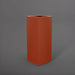 Perth Tall Corner Fiberglass Planter in matte terra cotta against gray background.