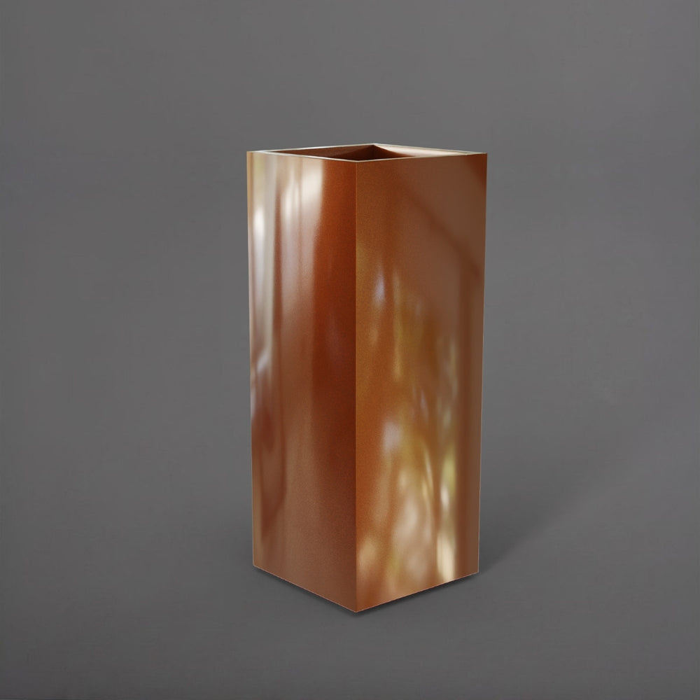 Perth Tall Corner Fiberglass Planter in metallic bronze against gray background.