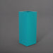 Perth Tall Corner Fiberglass Planter in satin seafoam green against gray background.