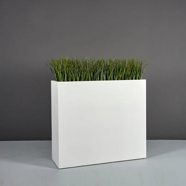 Perth Tall Rectangle Fiberglass Planter on concrete filled with plants.