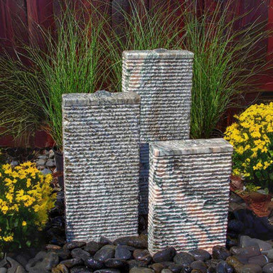 Pink Marble Granite Ripple Fountain on black pebbles in action