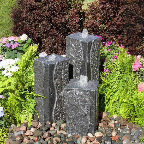 Polished Corner Triple Granite Fountain Kit on mixed pebbles in action