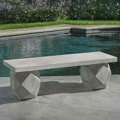 Polyhedron Bench on concrete beside swimming pool