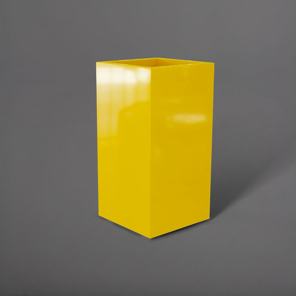 Potsdam Tall Corner Fiberglass Planter in gloss saffron against gray background.