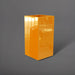 Potsdam Tall Corner Fiberglass Planter in gloss tangerine against gray background.