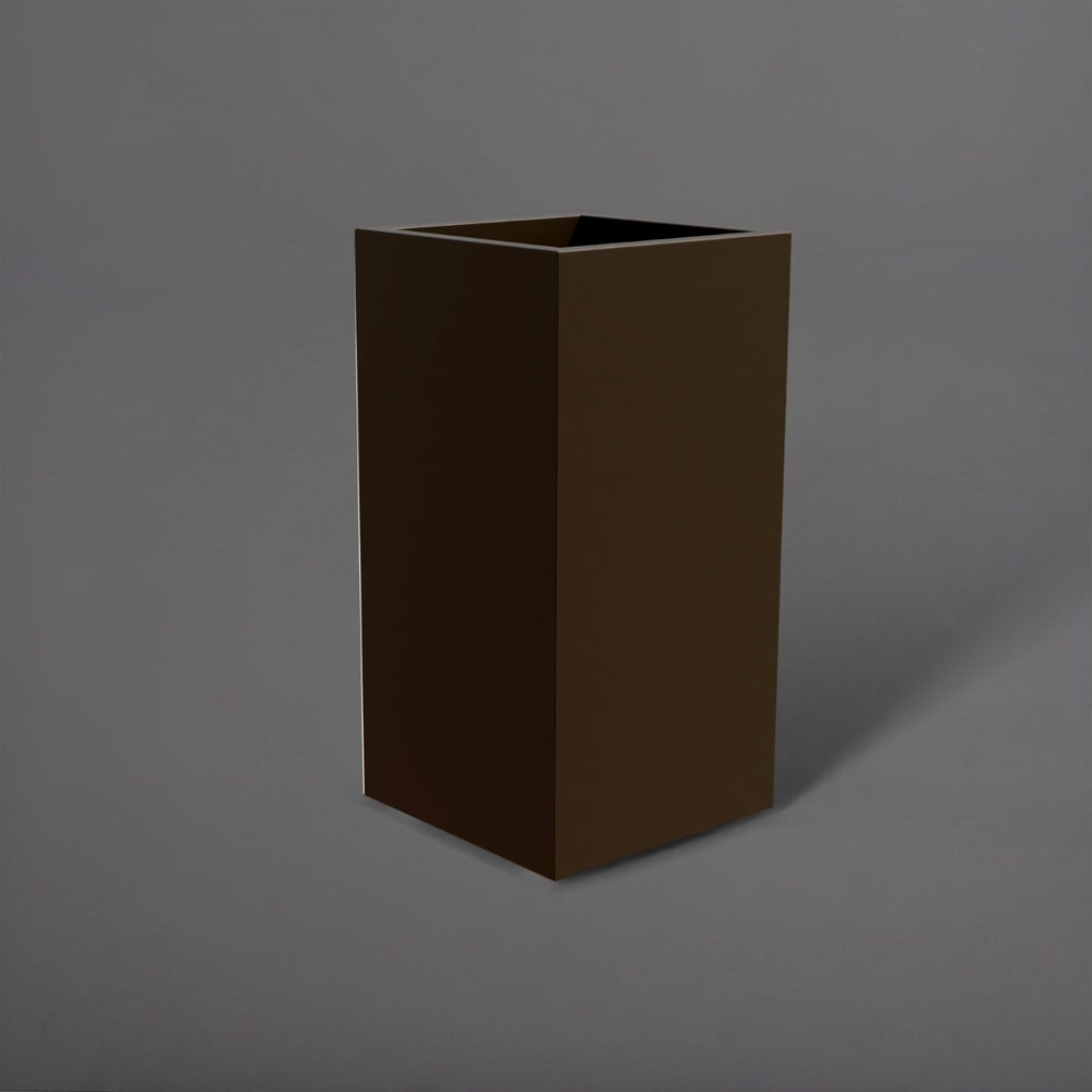 Potsdam Tall Corner Fiberglass Planter in matte bronze against gray background.