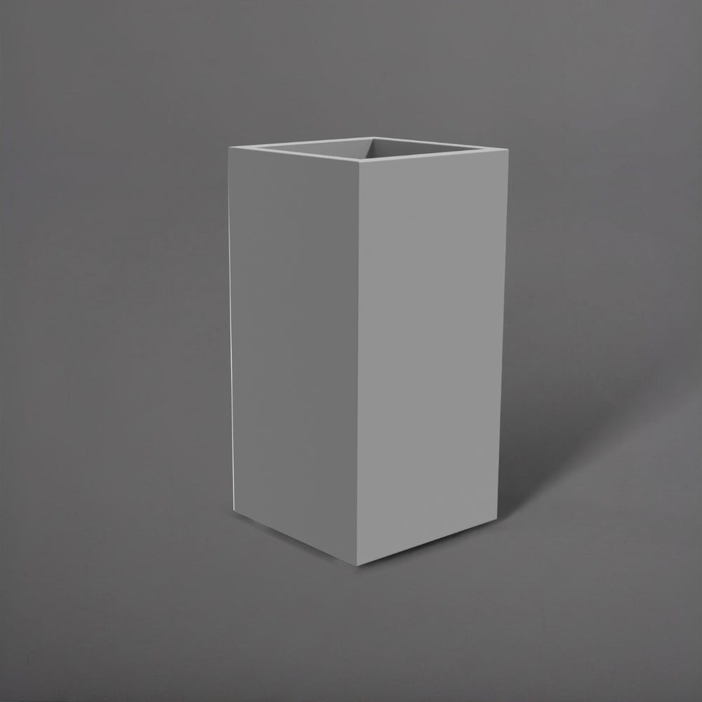 Potsdam Tall Corner Fiberglass Planter in matte cement grey against gray background.