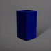 Potsdam Tall Corner Fiberglass Planter in matte cobalt blue against gray background.