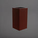 Potsdam Tall Corner Fiberglass Planter in matte dark brown against gray background.