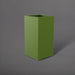 Potsdam Tall Corner Fiberglass Planter in satin green against gray background.