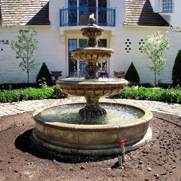 Provence Three Tier Pond Fountain in action against the white house.