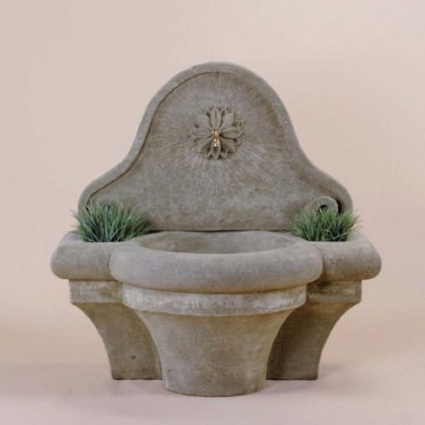 Provence Wall Fountain for spout against brown background.