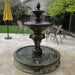 Quattro Lion Two Tier Pond Fountain on concrete in action.