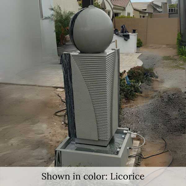 Ribbed Monolith Fountain in the backyard.