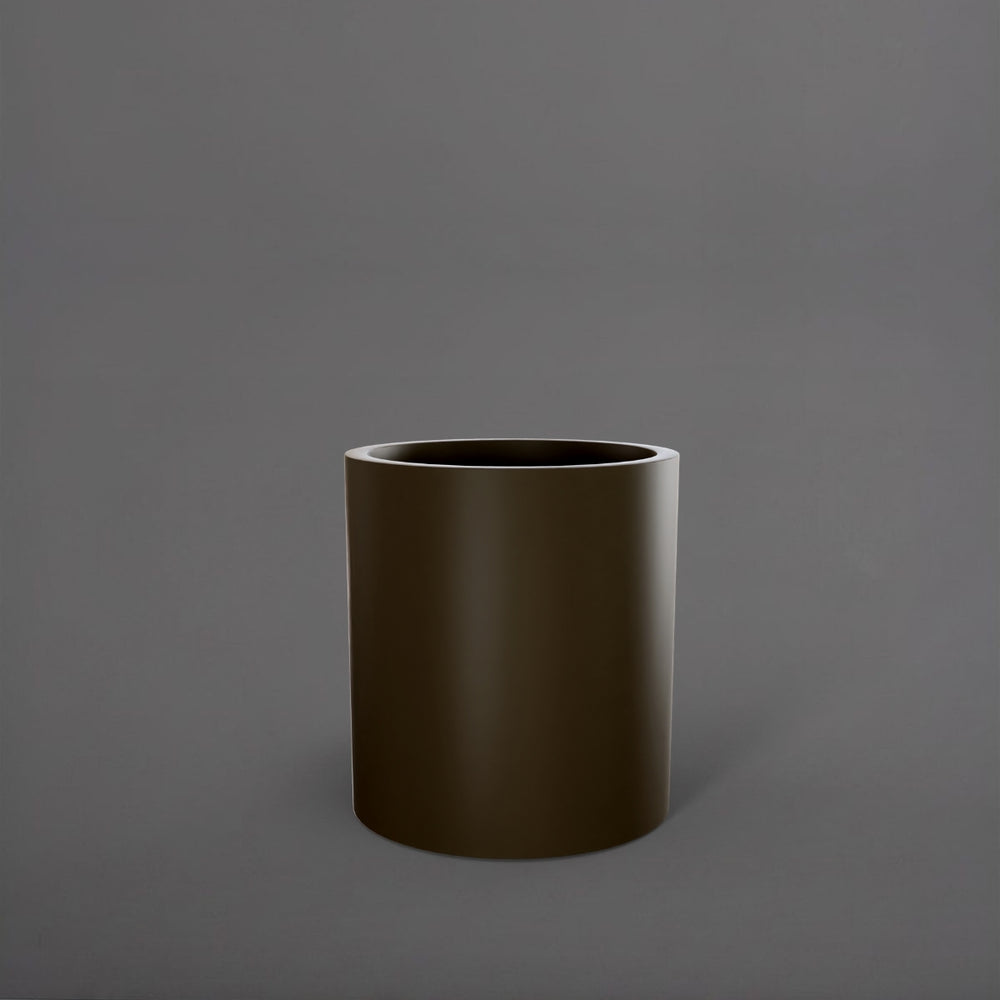 Rio Grande Cylinder Fiberglass Planter in matte bronze against gray background.
