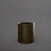 Rio Grande Cylinder Fiberglass Planter in matte bronze against gray background.