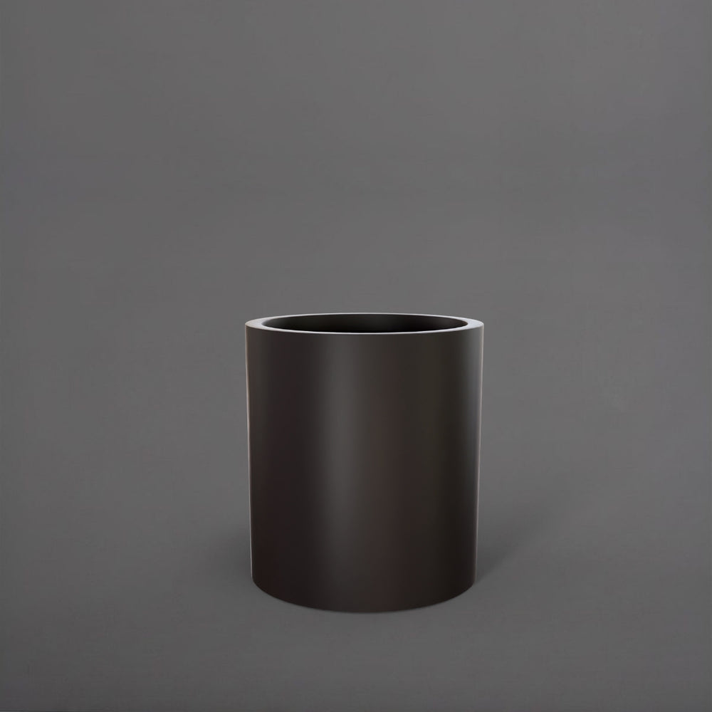 Rio Grande Cylinder Fiberglass Planter in matte charcoal against gray background.