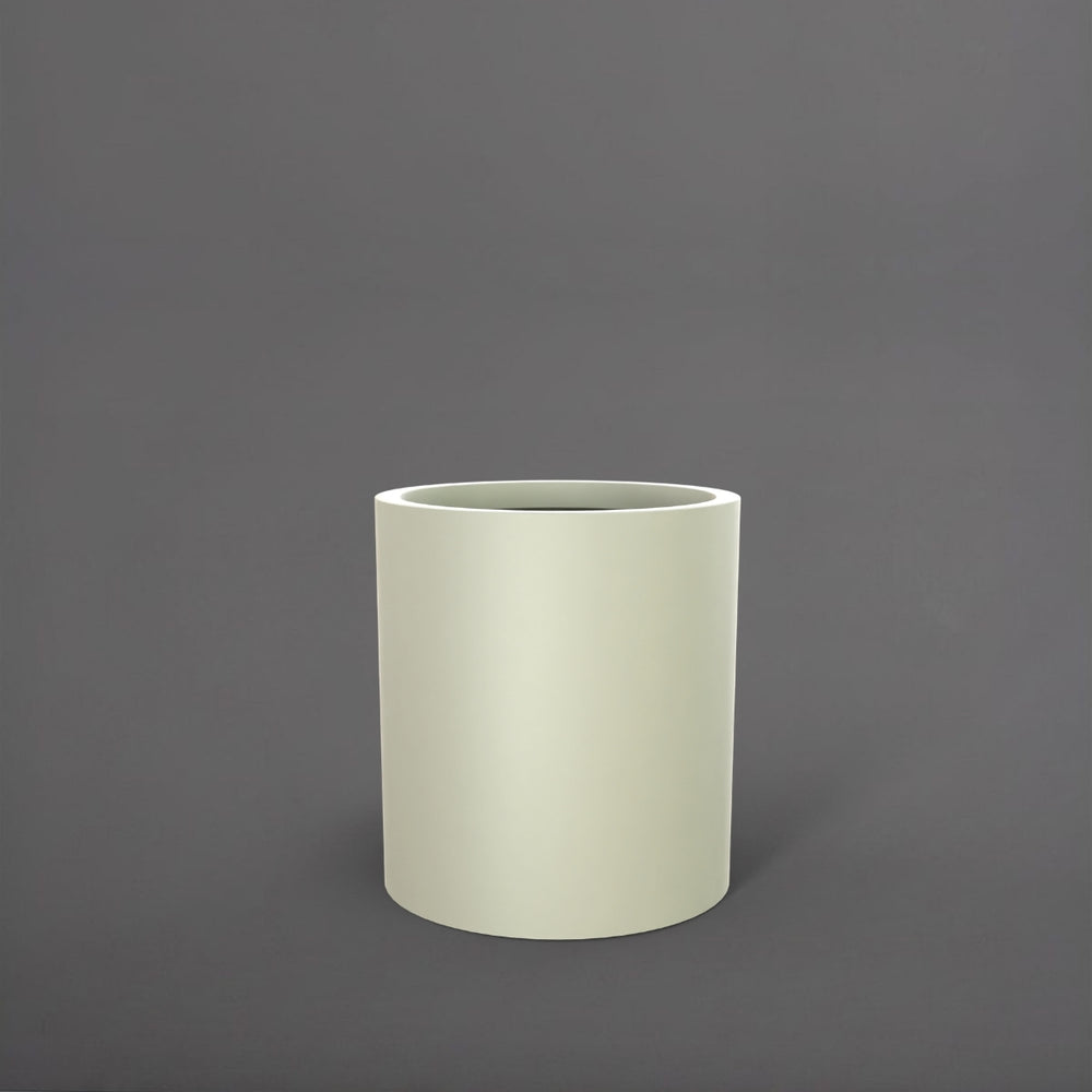 Rio Grande Cylinder Fiberglass Planter in satin beige against gray background.