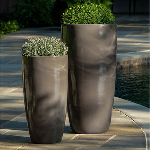 Rioja Planter - Fog - S/2 filled with plants near swimming pool