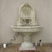 Robbiana Wall Fountain win action against cream wall.