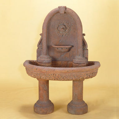 Robbiana Wall Fountain with Two Pedestals against yellow background