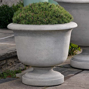 Sag Harbor Urn on concrete filled with plants