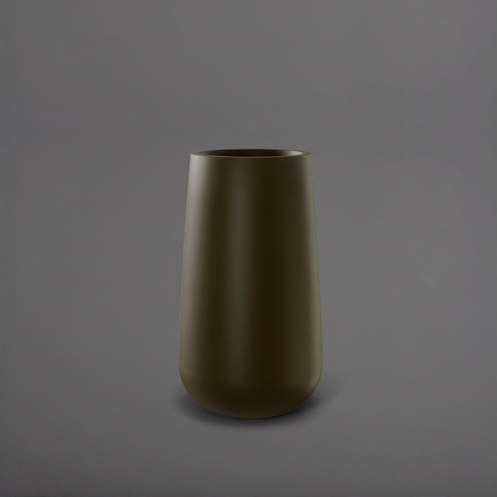 Saigon Tapered Round Fiberglass Planter in matte bronze against gray background.