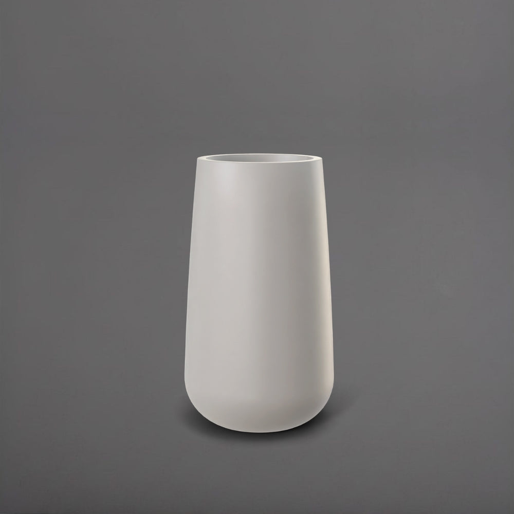 Saigon Tapered Round Fiberglass Planter in matte cement grey against gray background.