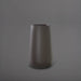Saigon Tapered Round Fiberglass Planter in matte gunmetal against gray background.