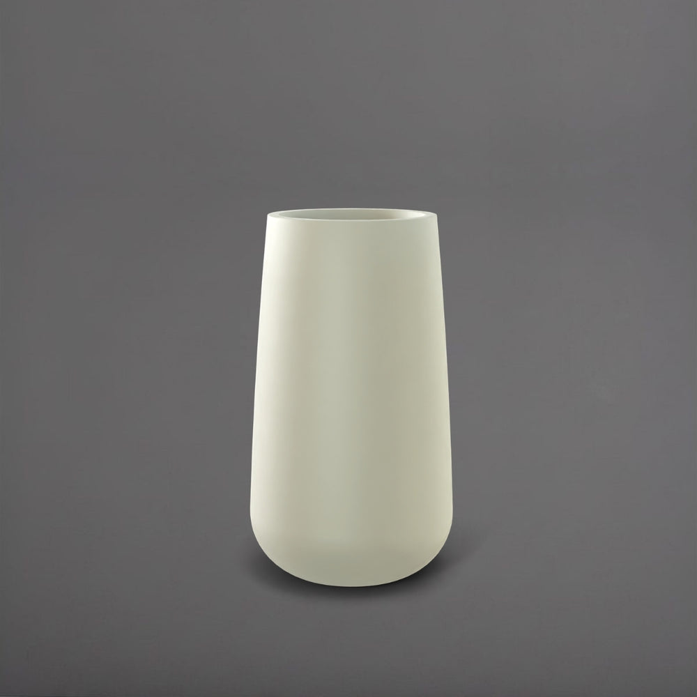 Saigon Tapered Round Fiberglass Planter in satin beige against gray background.