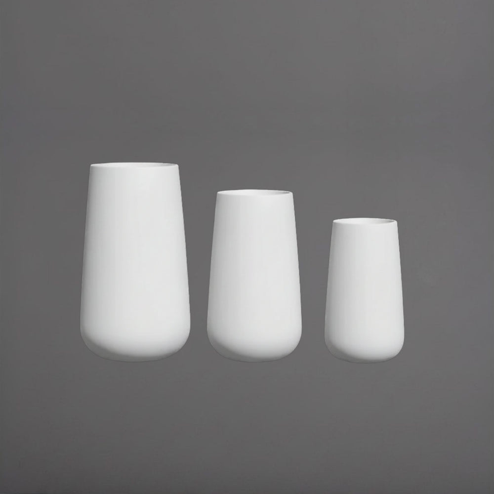Saigon Tapered Round Fiberglass Planter shown in different sizes.