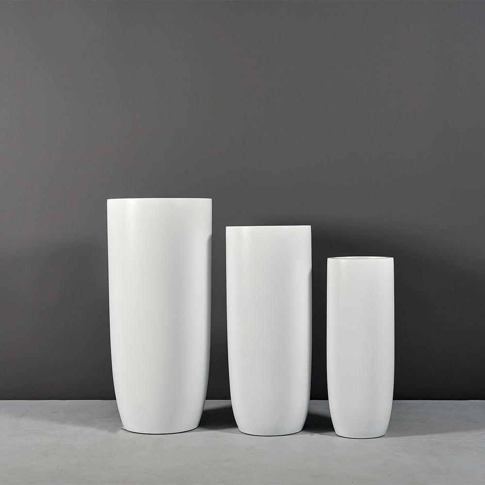 Saint Tropez Tall Bullet Round Fiberglass Planter shown with different sizes.