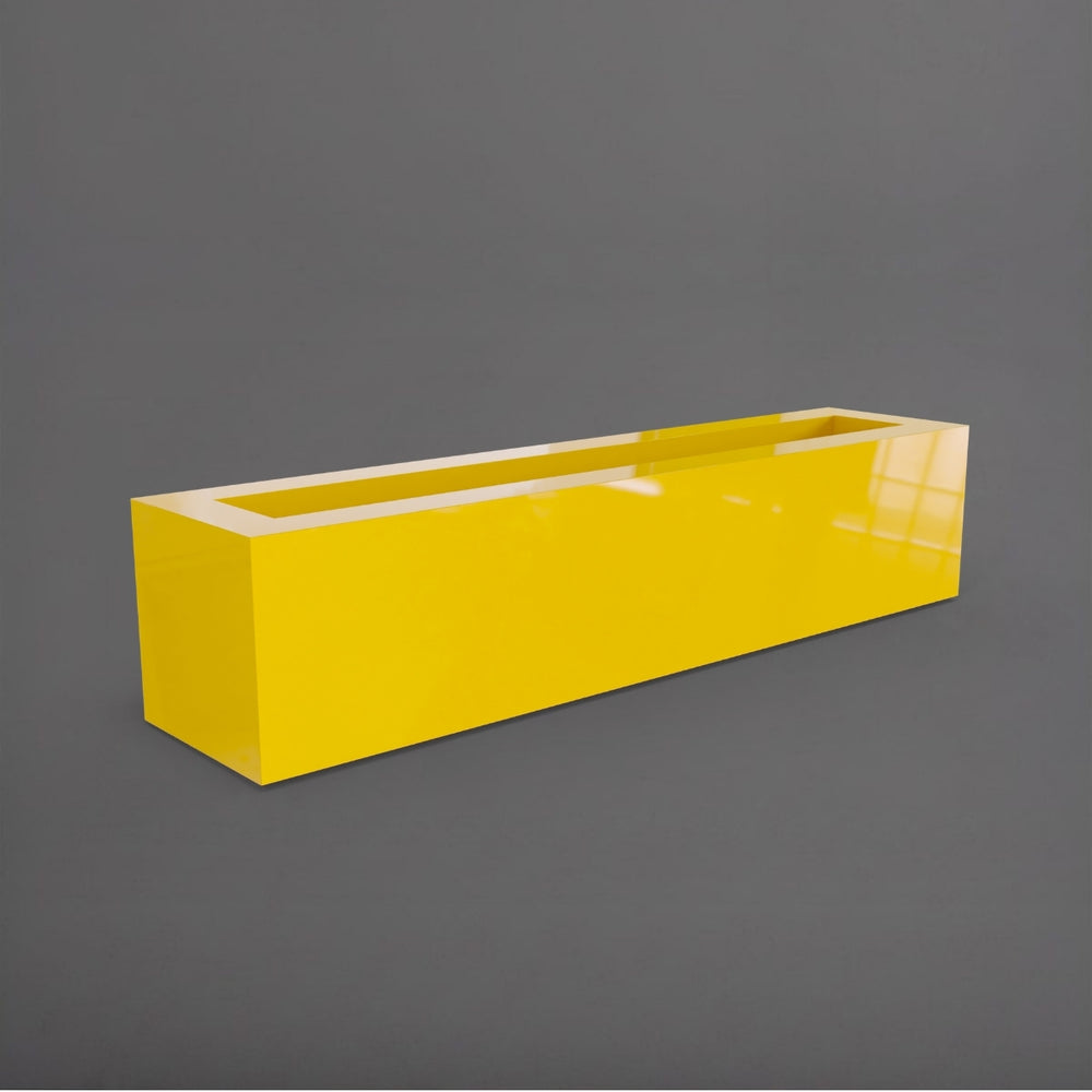Salon Narrow Rectangle Fiberglass Planter in gloss saffron against gray background. 