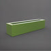Salon Narrow Rectangle Fiberglass Planter in satin green against gray background. 