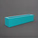 Salon Narrow Rectangle Fiberglass Planter in satin seafoam green against gray background. 
