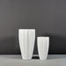 San Jose Tall Fluted Round Fiberglass Planter on concrete shown with different sizes.
