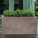 Sandal Planter 482424 S/1 in riverstone premium lite on concrete in the backyard.
