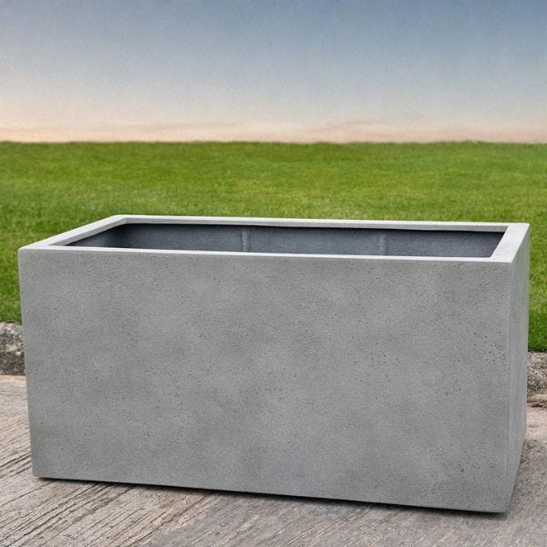 Sandal Planter 482424 S/1 in stone grey lite on concrete in the backyard.