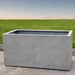 Sandal Planter 482424 S/1 in stone grey lite on concrete in the backyard.