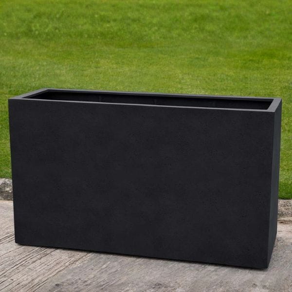 Sandal Planter 591836 S/1 in onyx black lite on concrete in the backyard.