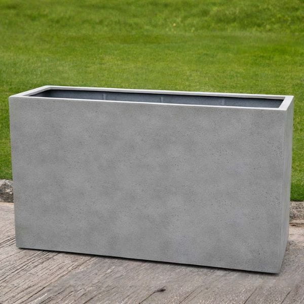 Sandal Planter 591836 S/1 in stone grey lite on concrete in the backyard.