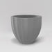 Santa Barbara Fluted Round Fiberglass Planter in matte cement grey against gray background.