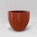 Santa Barbara Fluted Round Fiberglass Planter in matte terra cotta against gray background.
