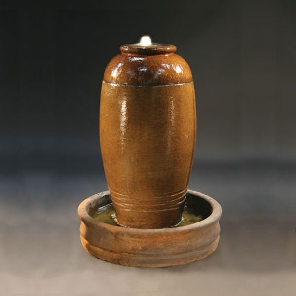 Santiago Urn Fountain running against dark background