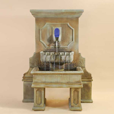 Savonna Wall Fountain with legs against brown background.